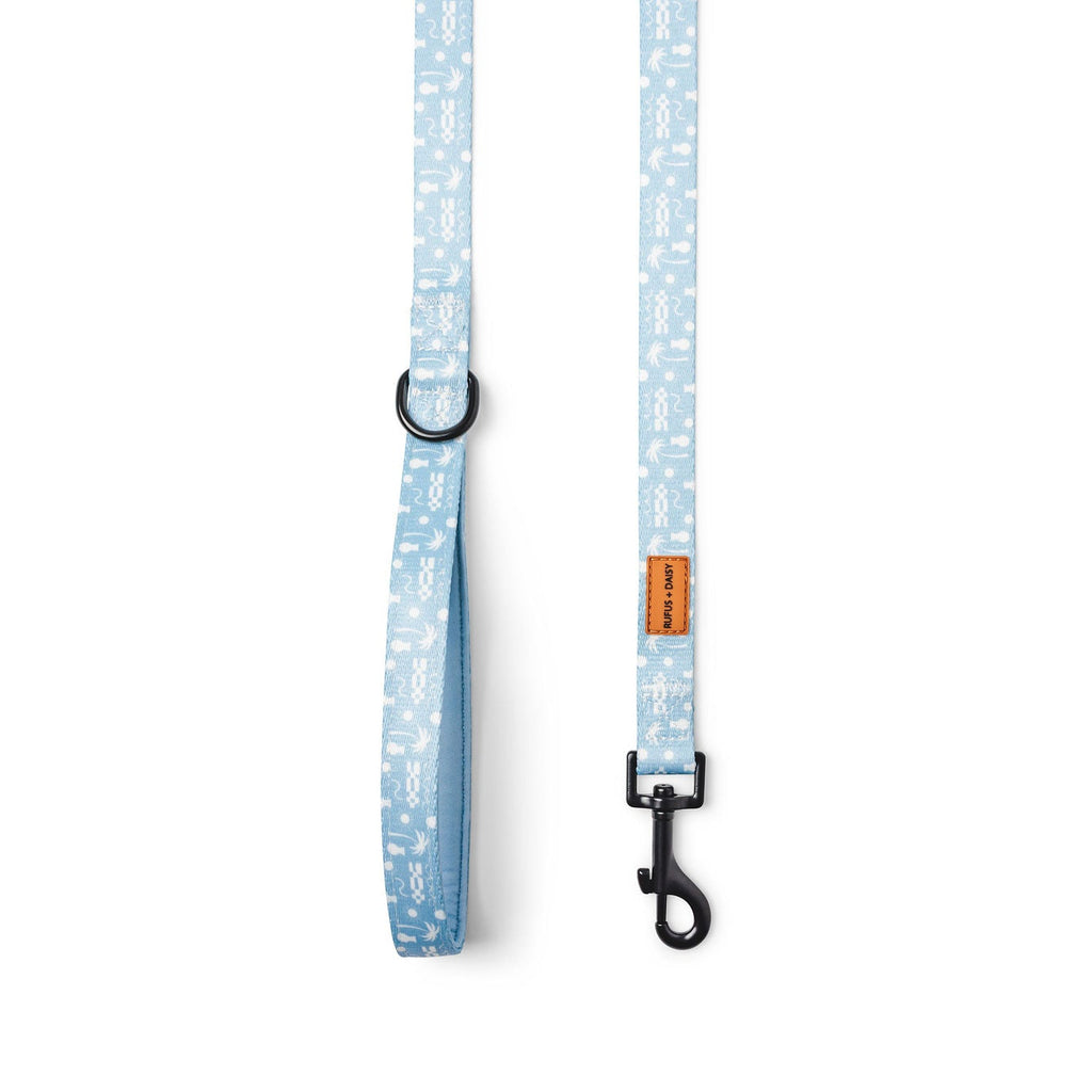 Dog leash with blue and white palm tree pattern on a white background