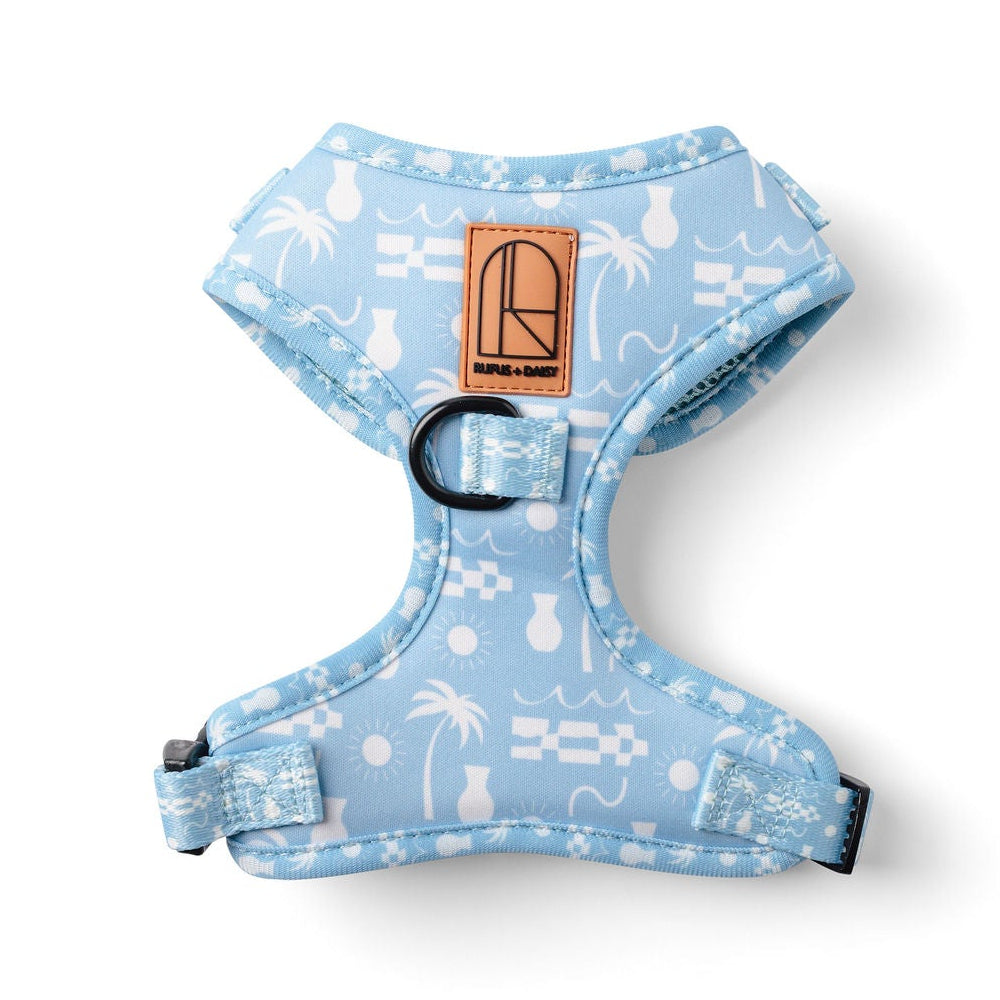 Dog harness with blue palm tree pattern on a white background
